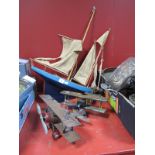 A Wooden Sailing Pond Yacht, wooden masts, cotton sails, painted in colours, a studded tinplate