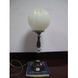 A 1920's Bakelite and Chrome Table Lamp, with a glass shade.