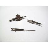 Cold Stream Guards Rifle Brooch, stamped "Sterling", together with an 'Ypres' bayonet brooch and a