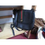 A Vintage Gucci Shoulder Bag, in black leather and monogrammed canvas, with green and red stripe