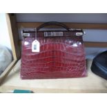 A c.1940's Dark Red Crocodile Effect Leather Handbag, with chrome clasps.