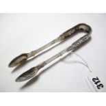 A Pair of Early XIX Century Hallmarked Silver Sugar Tongs, James Le Bass, Dublin, with flowerhead