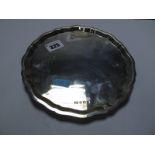 A Hallmarked Silver Card Tray, EV, Sheffield 1936, of shaped circular form, raised on three feet,