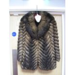 A Ladies Fox Fur Jacket, shading dark to light brown in a chevron design to body and sleeves and