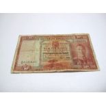 A Low Grade and Stained Southern Rhodesia Ten Shilling banknote, 15th December 1939, Salisbury,
