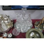 A Pair of Lead Crystal Decanters, slice cut and cross cut decoration on star patterned bases, with