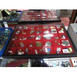 A Display Case, containing enamel pin badges, relating to Butlins, British Legion, railway, Red