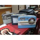 Three Vintage Portable Radios, including a Baird in blue and white with circular tuning dial, a