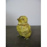 A Novelty Cast Metal Vesta, formed as a chick, hinged head and match striker to base, painted in