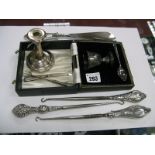 Hallmarked Silver Button Hooks and Shoe Horn, together with a hallmarked silver taper candlestick,