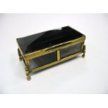 A XIX Century Polished Hardstone Trinket Box, of rectangular form with gilt mounts, on four ball