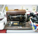 A Walnut Cased CWS Federation Sewing Machine.