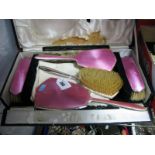 A Hallmarked Silver and Pink Enamel Five Piece Dressing Table Set, comprising two pairs of brushes