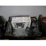 A Sony Playstation Model SCPH -7502, with power and RF leads, two controllers and eleven games,