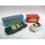 * A Scottoy Cadillac Elderado, in reproduction Mercury box and a re-issue Quiralu Isetta, boxed.