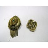 A XIX Century Continental Brooch, of oval form with textured detail and fringe drop, stamped,