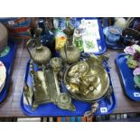 A Pair of Indian Brass Ewer Jugs, embossed decoration of scrolls, feathers and deities, a cast brass