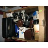 A Pentax K1000 Camera, a Braun Paxette camera, Flexamet box camera, Minolta, a zoom lens, a