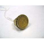 An Edward VII Half Sovereign, 1906, loose set within 9ct gold gent's ring mount.