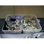 Beads, bangles, hat pins, costume jewellery, in two tubs.