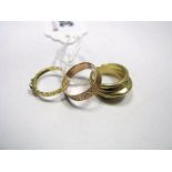 A 9ct Gold Patterned Band, together with another ring stamped "k18" and another ring. (3)
