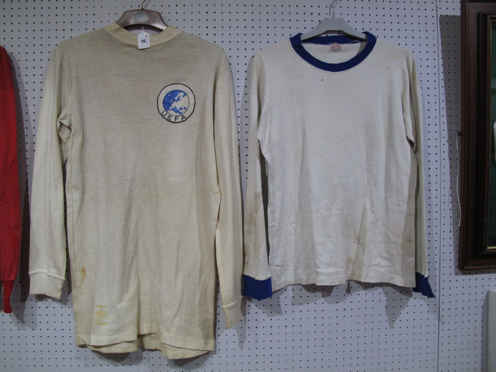 A White Football Match Shirt, bearing circular UEFA badge to front and red number "17" to back, with