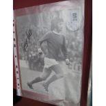 George Best Autograph, black pen signed on a black and white soccer annual picture of him in