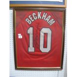 David Beckham. Autograph. Black pen signed on the back of a Manchester United No. 10 shirt. Mounted,