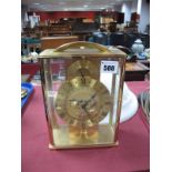 An Imexal Electric Globe Clock, with brass frame and arch carrying handle.