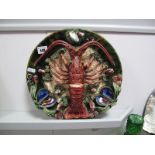 A XIX Century Continental Majolica Style Pottery Wall Plaque, featuring lobster, oysters and shells.