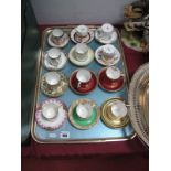 Twelve Paragon China Early XX Century Coffee Cans, with matching saucers, varying patterns,