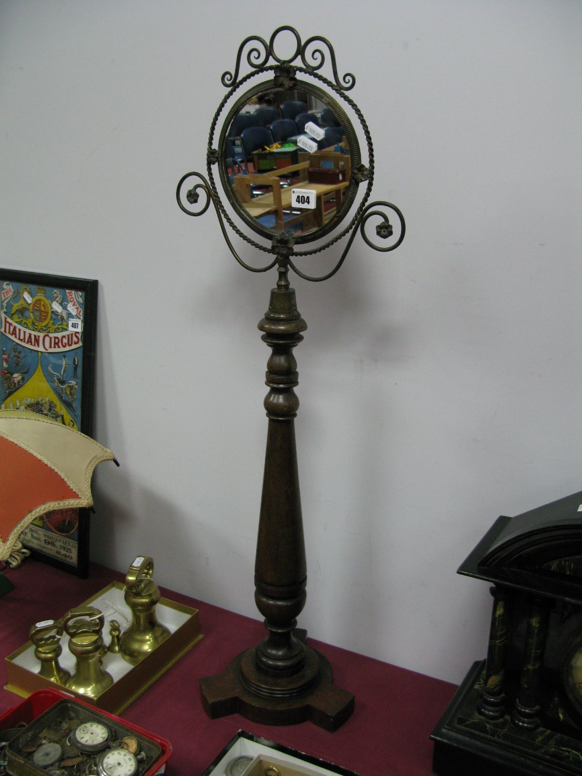 A XIX Century Shaving Circular Mirror, on turned mahogany pedestal with trifold base.