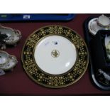 A Wedgwood Plate, in the Astbury design, with classical style black and gilt border to cream ground,