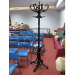 A Victorian Ebonised Bentwood Hat and Coat Stand, raised on four ball feet.