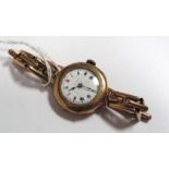 A 9ct Gold Cased Lady's Wristwatch, the white dial with black and red Roman numerals, within plain