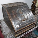 A XIX Century Carved Pine Box, with a fall front and coat of arms, of a lion on the top of a castle,