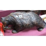 A Large XX Century Large Black Forest Style Carved Wooden Model, of a walking bear with a fish in