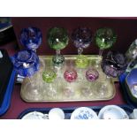 A Set of Six Hock Glasses, with waisted faceted stems and harlequin bowls, five similar liqueurs.
