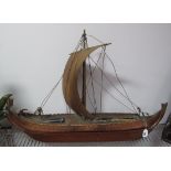A Circa 1950's Copper Novelty Table Lamp, formed as a viking longship mounted on a mahogany stand,