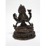 A XX Century Tibetan Hollow Cast Bronze Figure of Buddha, seated on a lotus decorated pedestal, 11.