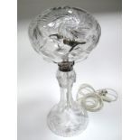 A Large Cut Crystal Table Lamp, of mushroom shape, fitted with plated mounts, the waisted pedestal