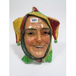 A Royal Doulton Pottery Wall Mask, modelled as a laughing jester, 28.5cms high.