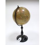 An Early XX Century "Geographica" 6" Terrestrial Globe, on a turned and ebonised wood stand, 31cms