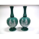 A Pair of Victorian Green Opaque Glass Vases, of shaft and globe form, each white enamelled to the