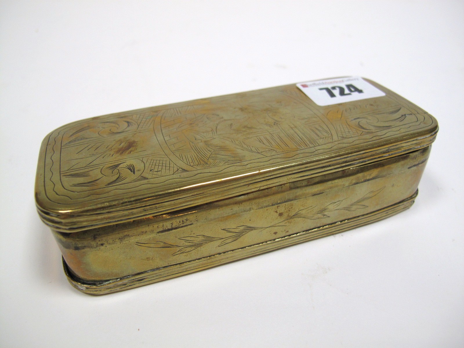 An XVIII Century Dutch Brass Tobacco Box, of rounded rectangular form, engraved with figural panels,