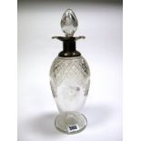 A Hallmarked Silver Mounted Cut Glass Decanter, Sheffield 1915, of elongated ovoid form,