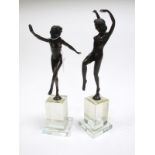A Pair of Art Deco Style Bronze Figures of Dancing Nude Girls, each signed Masier to the base, on
