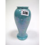 An Early XX Century Ruskin Pottery Vase, of tall baluster form, allover with a turquoise speckled