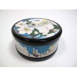 A Moorcroft Pottery Circular Lidded Box, tubelined and decorated in the Christmas Morn design by