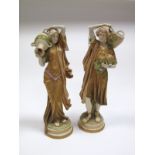 A Pair of Early XX Century Royal Dux China Figures, modelled as a Roman couple, he with a basket